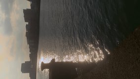 Ground level shot captures Belfast urban skyline from River Lagan waterfront perspective, vertical video - Powered by Shutterstock - Get 15% off with code: PIKWIZARD15