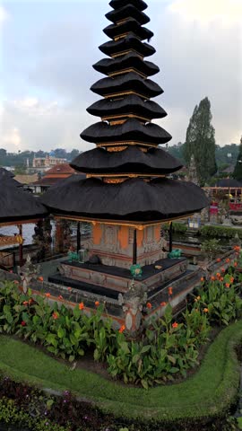 Aerial view of the iconic Ulun Danu Beratan Temple on the lake in Bali, Indonesia. Serene water and peaceful tropical surroundings.