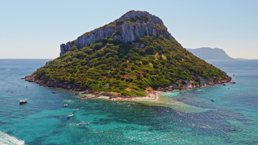 The Figarolo bay in Golfo Aranci viewd by drone in a summer day.
North Sardinia near Olbia and Costa Smeralda.