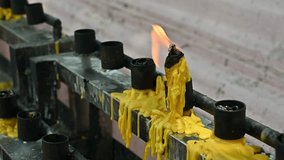 A candle while burning in Buddhist temple in Thailand. The faithful also light candles as a sign of gratitude to God for answered prayers. - Powered by Shutterstock - Get 15% off with code: PIKWIZARD15