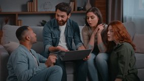 Joyful happy multiracial four friends shopping laptop celebrating achieve applauding yes gesture successful winning money online bet casino at home party on couch diverse men women using credit card - Powered by Shutterstock - Get 15% off with code: PIKWIZARD15