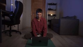 Evening meditation at home after work, young man practicing mindfulness for stress relief - Powered by Shutterstock - Get 15% off with code: PIKWIZARD15