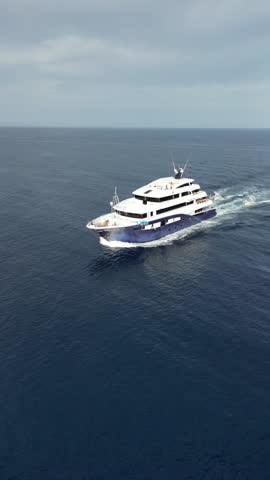 Luxury cruise yacht sailing in the Red Sea for kitesurfing and diving tour, aerial view