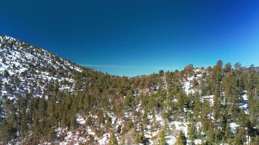 Drone Flight Over Snow Covered Mountains In Big Bear Lake, California