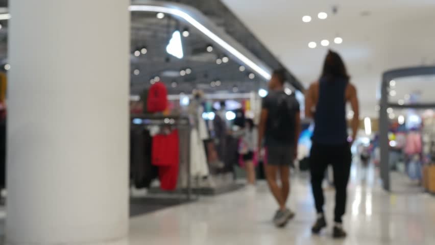 Blurred Abstract Shopping Mall Interior with Colorful Store Displays and Modern Retail Architecture