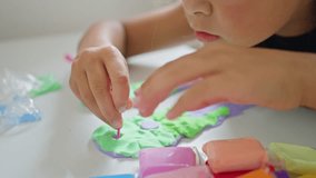 A Creative Child Fully Engaging with Various Colorful Play Dough Activities and More - Powered by Shutterstock - Get 15% off with code: PIKWIZARD15