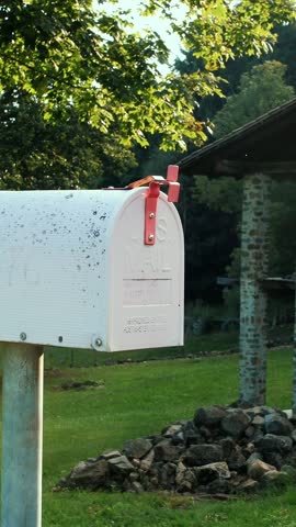 A mailbox in an Italian village in the Alps. During summer at sunset. High quality 4k footage