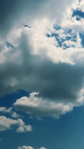 Light blue sky with translucent white and gray clouds of various shapes during daytime
