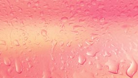 Water droplets and condensation flow down a vibrant, soft pink surface, creating a dynamic and abstract background. - Powered by Shutterstock - Get 15% off with code: PIKWIZARD15