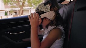 Young passenger wearing virtual reality headset immersing in digital world while traveling, experiencing innovative entertainment during family road trip journey - Powered by Shutterstock - Get 15% off with code: PIKWIZARD15