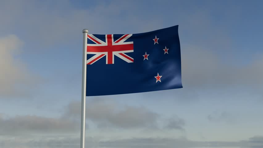New Zealand flag flowing under wind and rippled blue sky and cloud.