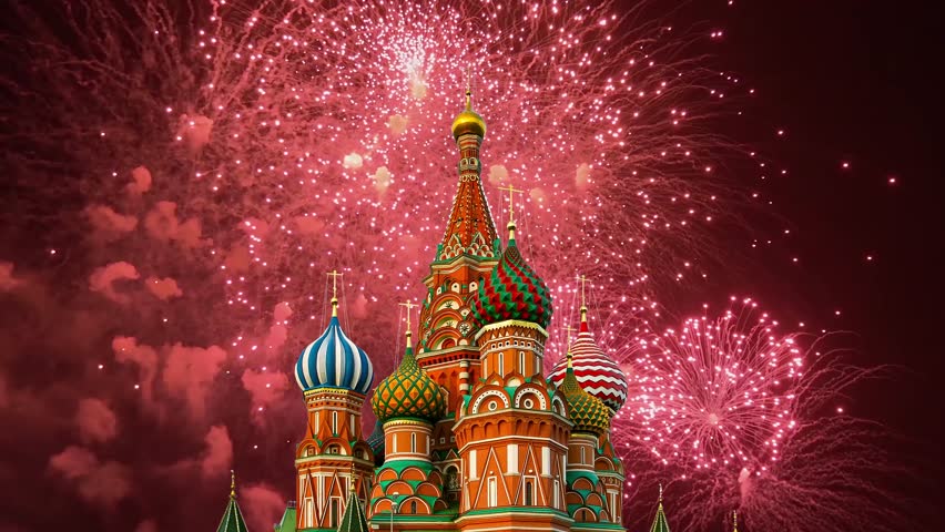 Temple of Basil the Blessed and fireworks in honor of Victory Day celebration (WWII), Red Square, Moscow, Russia. Time lapse, with zoom