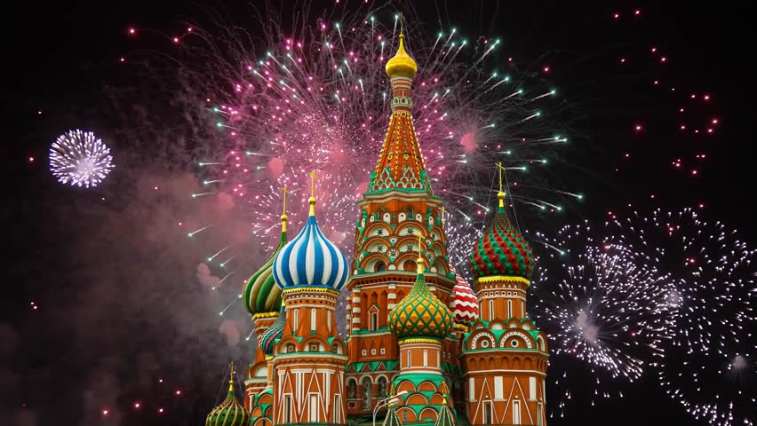 Temple of Basil the Blessed and fireworks in honor of Victory Day celebration (WWII), Red Square, Moscow, Russia. Time lapse, with zoom