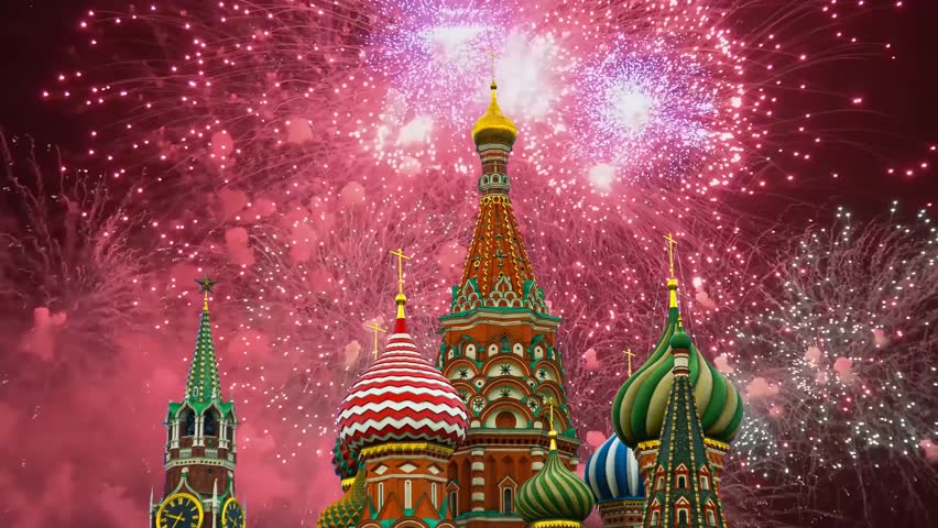 Temple of Basil the Blessed and fireworks in honor of Victory Day celebration (WWII), Red Square, Moscow, Russia. Time lapse, with zoom
