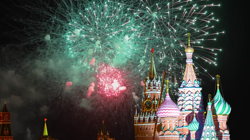 Temple of Basil the Blessed and fireworks in honor of Victory Day celebration (WWII), Red Square, Moscow, Russia. Time lapse, with zoom