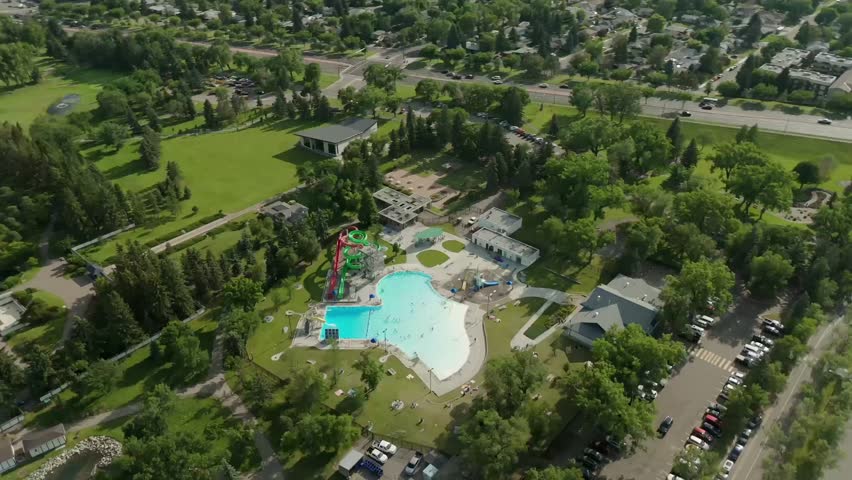 Aerial Orbit Henderson Pool in Lethbridge, Alberta - Sunny Summer Day