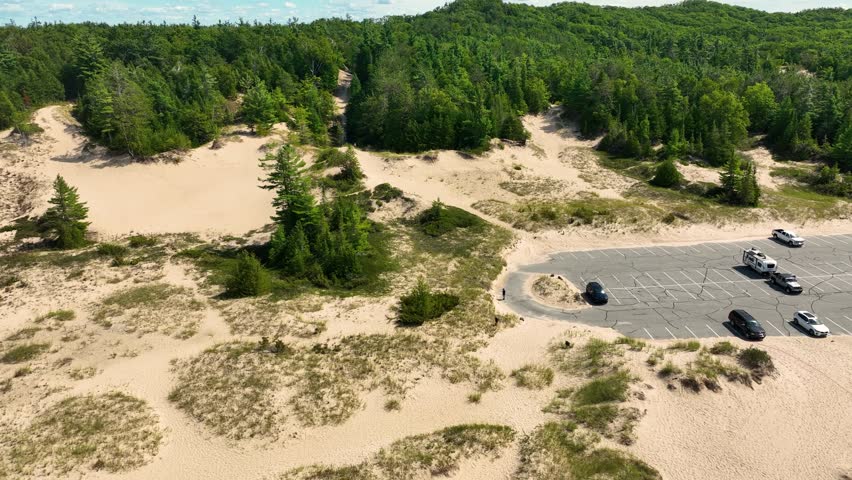 Forward push along the dunes, moving inland toward the park.