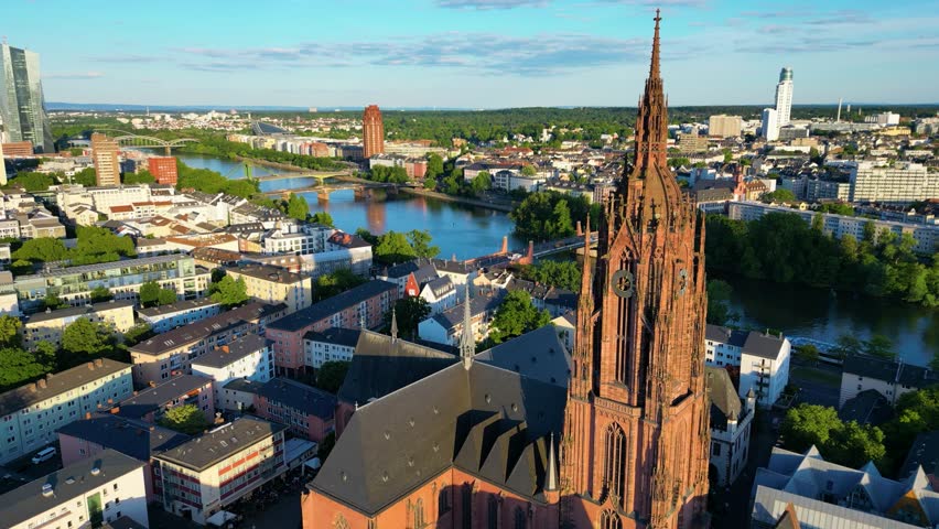 4K Drone Video of the Gothic-Style Kaiserdom St. Bartholomäus Cathedral and Evangelische Dreikönigskirche Church on the Main River in Downtown Frankfurt, Germany