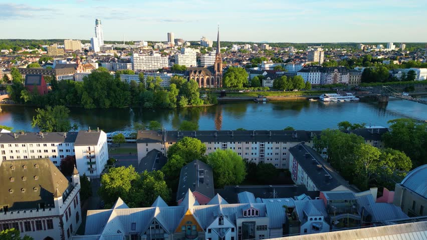 4K Drone Video of the Gothic-Style Kaiserdom St. Bartholomäus Cathedral and Evangelische Dreikönigskirche Church on the Main River in Downtown Frankfurt, Germany