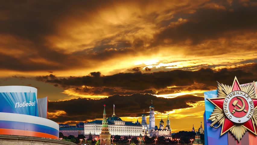 Moscow Kremlin (with decorations for the holiday of May 9 in honor of Victory Day celebration (WWII). Against the sunset, Russia. TRANSLATION: Victory!, Patriotic war. 4K, time lapse, zoom