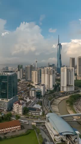 Kuala Lumpur Malaysia time lapse day to night high angle view city skyline at city center (vertical)