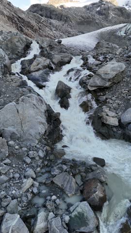 4K aerial drone footage of the Morteratsch Glacier in Engadin Valley, Switzerland. Scenic alpine landscape with snow-covered peaks, melting ice, and dramatic mountain scenery. Perfect for travel, tour
