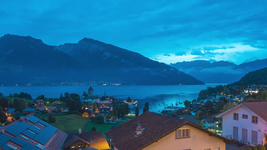 Spiez Switzerland time lapse night to day city skyline at Lake Thun