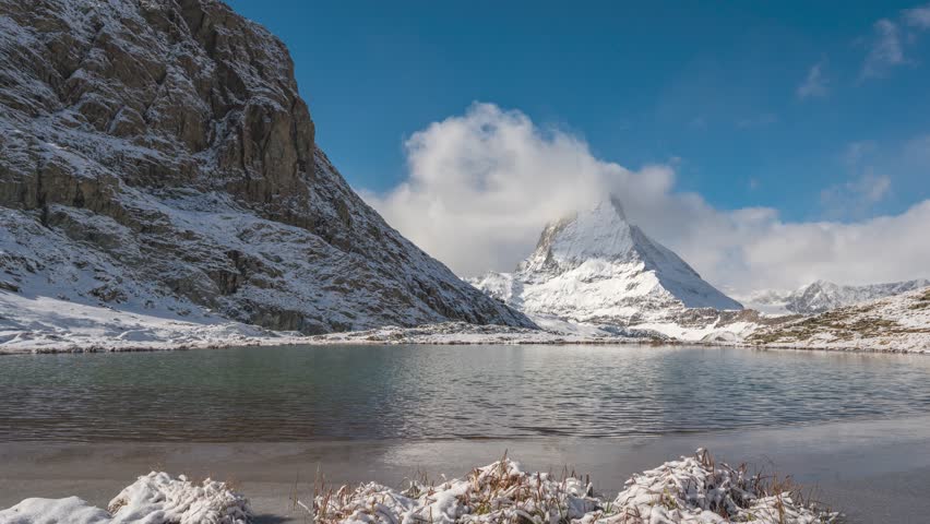 Zermatt Switzerland time lapse at Matterhorn mountain peak and Riffelsee lake in winter season