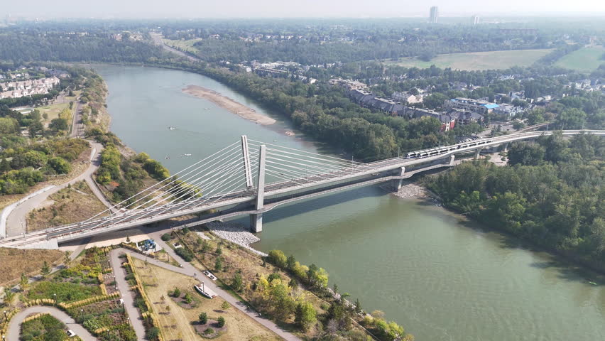 Aerial view of downtown Edmonton, Alberta, Canada, showcasing modern skyscrapers, office towers, and busy city streets on a clear summer day. Perfect for business, travel, architecture, and urban life
