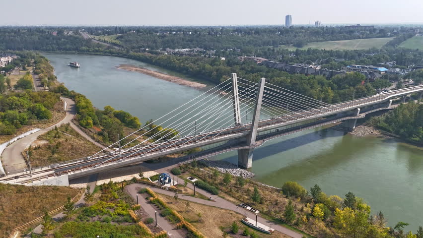 Aerial view of downtown Edmonton, Alberta, Canada, showcasing modern skyscrapers, office towers, and busy city streets on a clear summer day. 
Edmonton
Hyper lapse