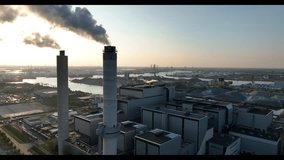 Industrial waste incineration in Amsterdam, smokestacks, chimneys. - Powered by Shutterstock - Get 15% off with code: PIKWIZARD15