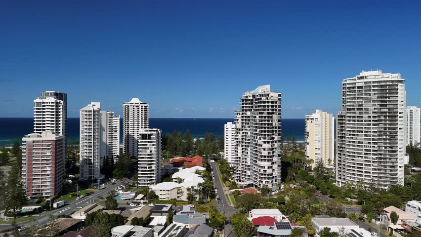 Gold Coast, Queensland, Australia: 4K Aerial Drone Footage featuring City Skyline, Main Beach, Surfers Paradise Towers, Luxury Apartment and Houses, Waterfront Estates and the Pacific Ocean Coastline.
