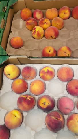  Peaches. Fruits on a store counter. Healthy nutrition and consumer choice in everyday life.