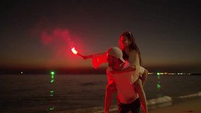 Happy man and woman travel the sea on summer beach holiday vacation. Asian family couple enjoy and fun outdoor active lifestyle playing sparkler fireworks together on tropical beach at night. - Powered by Shutterstock - Get 15% off with code: PIKWIZARD15