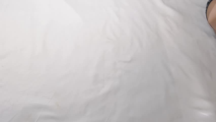 Concept footage of nickel and dime being held by left and right hands. The nickel, dime and the female hands are being shown in the clip.