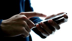 Successful Businessman tapping or scrolling on mobile phone smartphone and browsing internet online - Powered by Shutterstock - Get 15% off with code: PIKWIZARD15