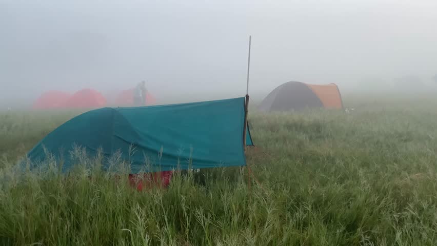 Morning sunrise over mountain campsite in Ranca Upas, Indonesia.