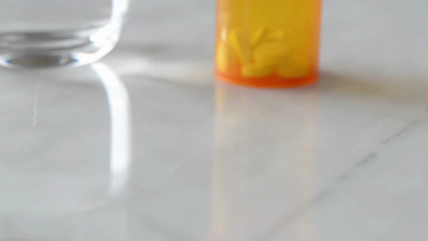 taking medicine painkiller pills on hand capsules health care medicare pharmacy and treatment concept close up