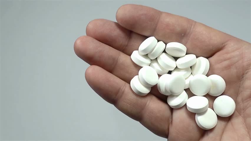 Drug over dose Concept Many Pills. Macro Of Hand Holding Several Pill Healthcare and Medicine