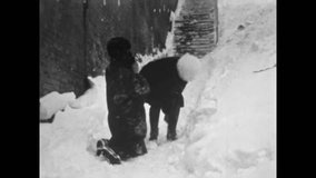 Proposes marriage in winter snowy street. Young man kneels in snow to girlfriend in city. Romantic couple relationship in cold outdoor. Vintage love film. Old archive. Archival retro 1960s proposal - Powered by Shutterstock - Get 15% off with code: PIKWIZARD15