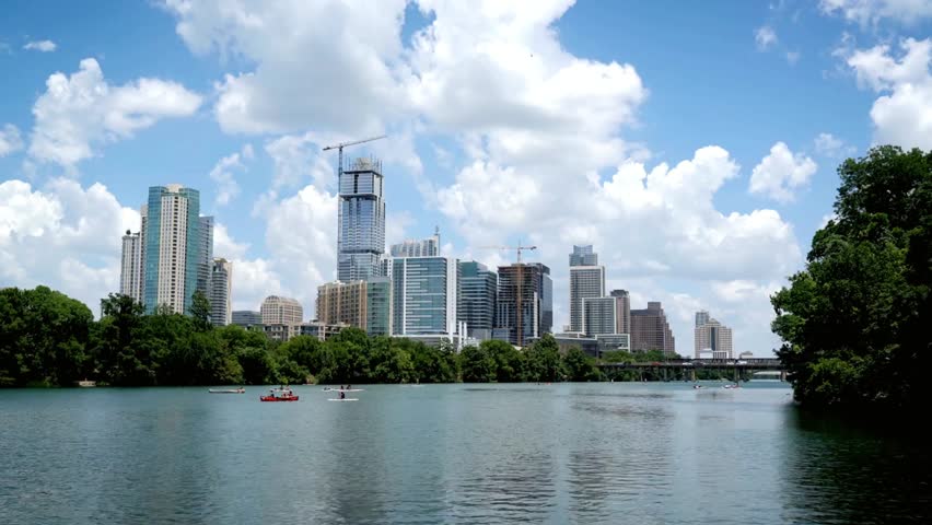 Austin texas skyline with buildings under construction on a sunny day with clouds