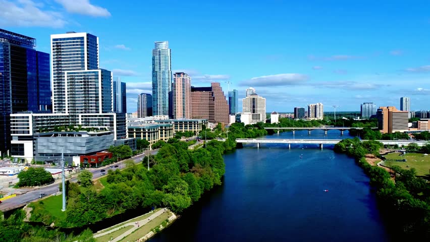 Aerial view of downtown austin texas skyline over lady bird lake on a sunny day