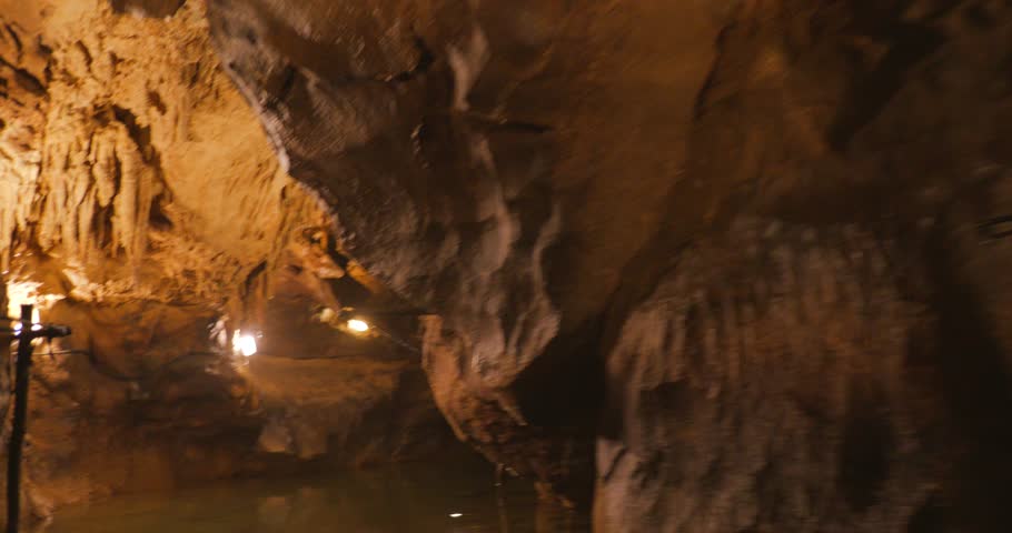 POV shot of exploring on Labouiche underground river in France.