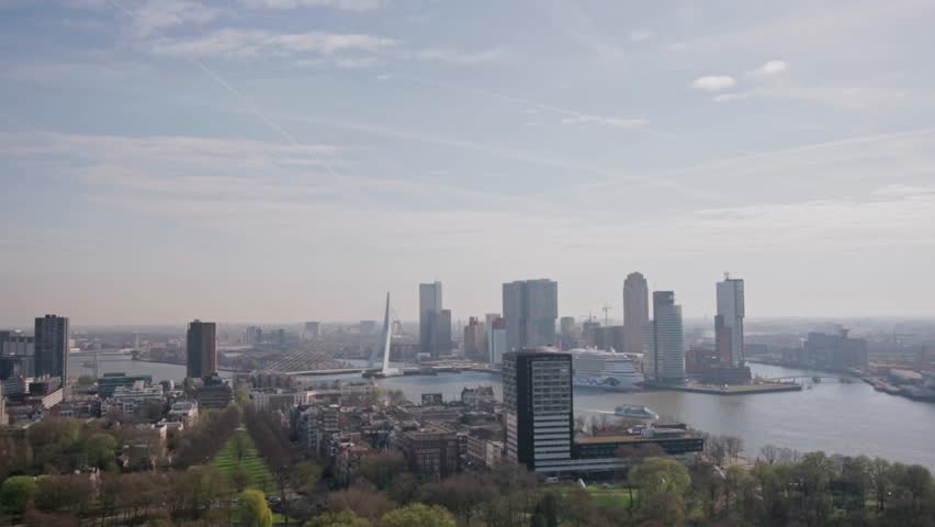 Cityscape with the city park in the foreground and financial district and city centre including the famous Erasmus bridge in the background