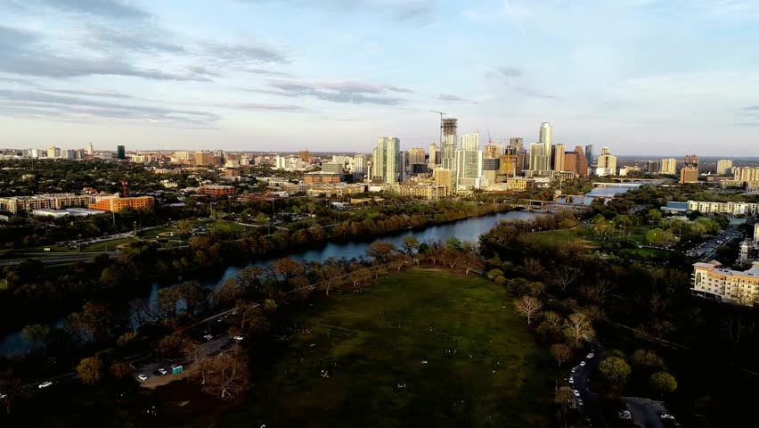Aerial view of the austin, texas skyline and lady bird lake at sunset