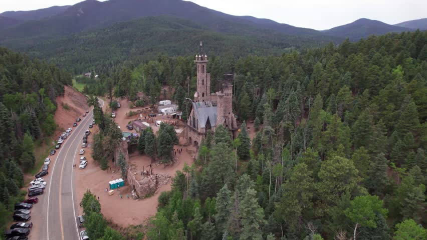 Aerial video of the Bishop Castle in Rye, Colorado. Camera rises up.