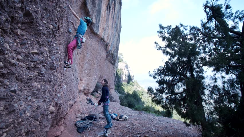 Two female friends going climbing in the mounatins nearby Barcelona, Spain. Women climbing outdoor. High quality 4k footage