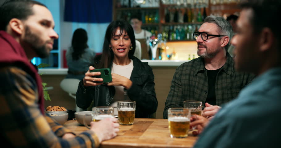 Friends, smile and phone for selfie in pub, conversation and social gathering for happy memory. Weekend event, people and bonding together for reunion, photography and online app in sports bar