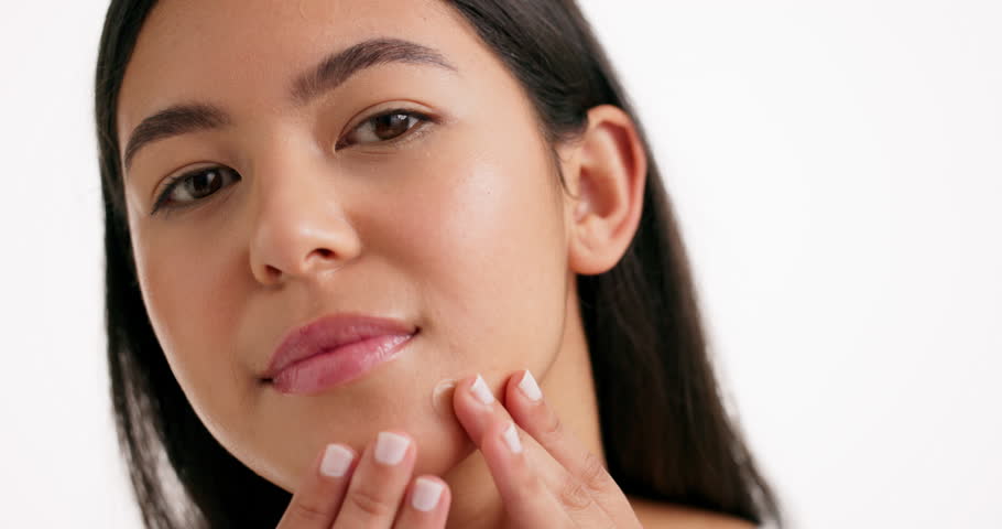 Face, woman and check patch for skincare in studio of pimple breakout, acne treatment and healing. Portrait, person and cosmetics for mockup space, dermatology and blemish control on white background