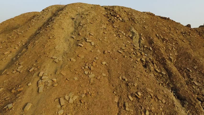 Drone view of Mohenjo-daro’s Great Stupa and ancient grid layout bathed in sunset light. A stunning glimpse into the urban brilliance of the Indus Valley Civilization.